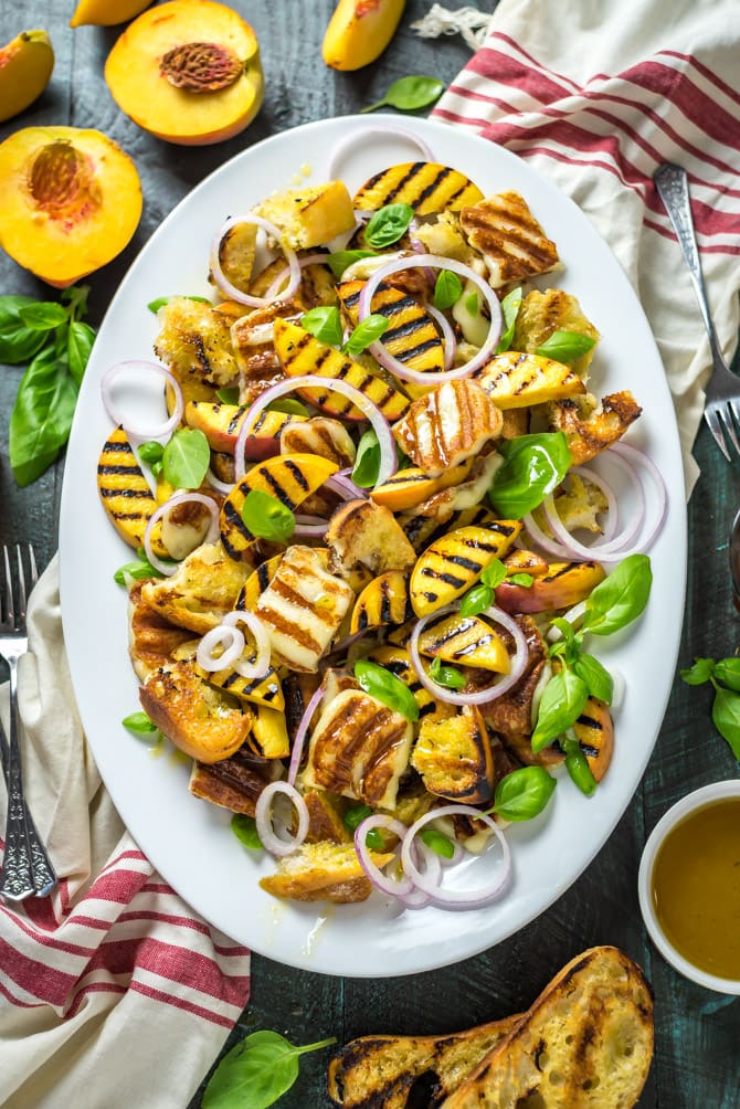 Grilled Peach and Halloumi Panzanella. This summer salad includes a mix of quickly grilled peaches, halloumi cheese, and ciabatta bread that's tossed with fresh basil, red onions, and a simple white balsamic vinaigrette. | hostthetoast.com