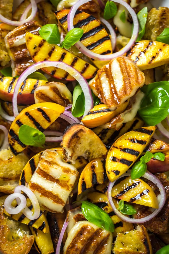 Grilled Peach and Halloumi Panzanella. This summer salad includes a mix of quickly grilled peaches, halloumi cheese, and ciabatta bread that's tossed with fresh basil, red onions, and a simple white balsamic vinaigrette. | hostthetoast.com