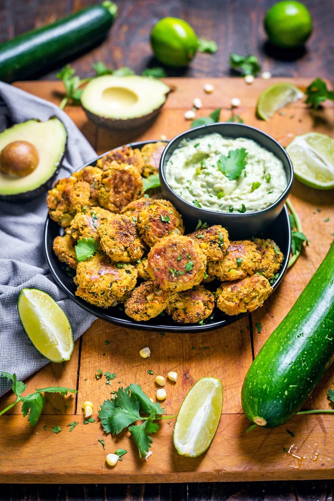 Southwestern Zucchini and Corn Bites with Avocado Ranch. No need to break out the fryer for this (conveniently gluten-free) recipe-- these bite-sized, veggie-loaded treats are baked until crisp on the outside and tender on the inside. | hostthetoast.com