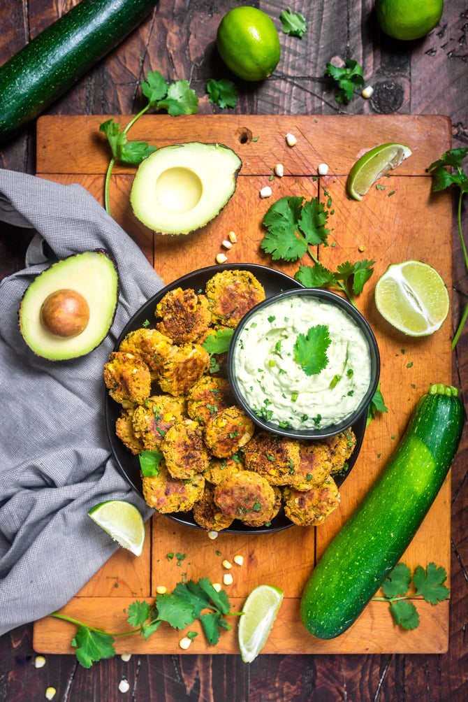 Southwestern Zucchini and Corn Bites with Avocado Ranch. No need to break out the fryer for this recipe-- these bite-sized, veggie-loaded treats are baked until crisp on the outside and tender on the inside. | hostthetoast.com