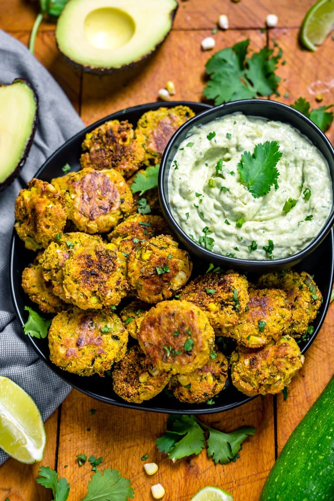 Southwestern Zucchini and Corn Bites with Avocado Ranch. No need to break out the fryer for this recipe-- these bite-sized, veggie-loaded treats are baked until crisp on the outside and tender on the inside. | hostthetoast.com