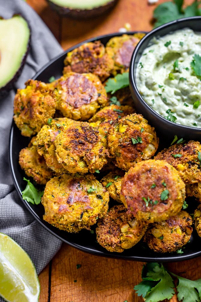 Southwestern Zucchini and Corn Bites with Avocado Ranch. No need to break out the fryer for this recipe-- these bite-sized, veggie-loaded treats are baked until crisp on the outside and tender on the inside.| hostthetoast.com