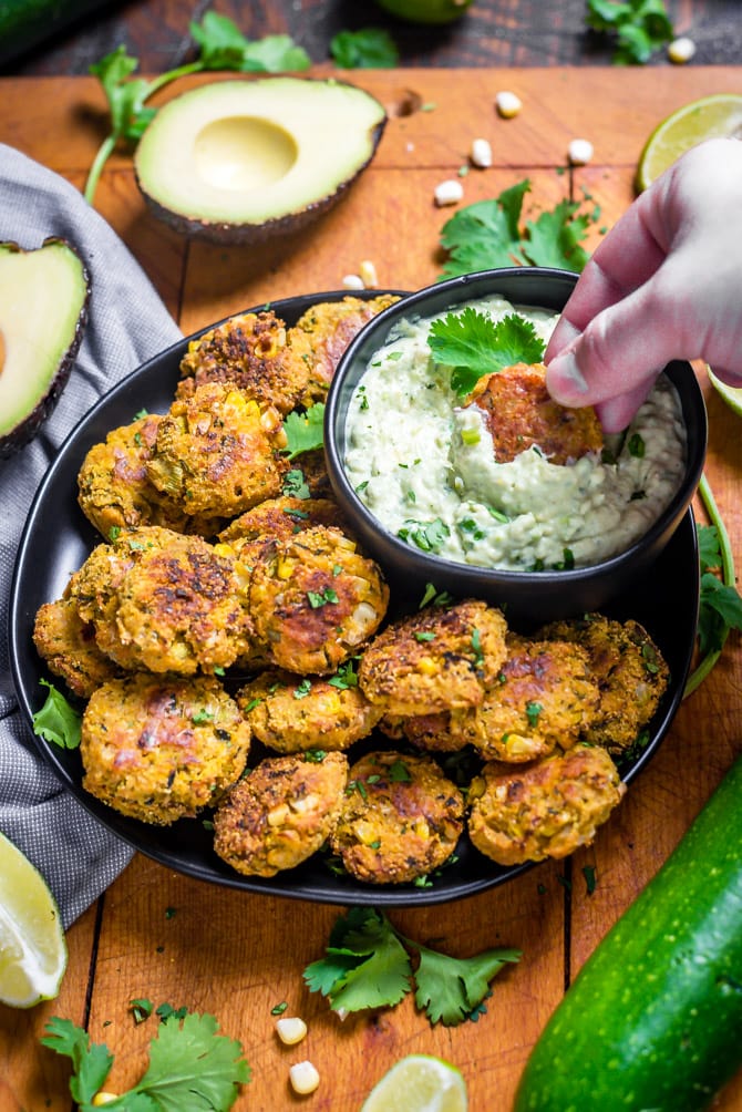 Southwestern Zucchini and Corn Bites with Avocado Ranch. No need to break out the fryer for this recipe-- these bite-sized, veggie-loaded treats are baked until crisp on the outside and tender on the inside.| hostthetoast.com