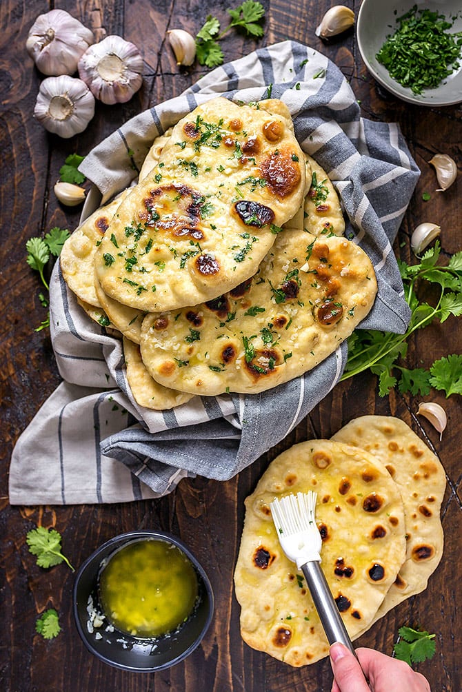 This Homemade Garlic Naan recipe is truly the best. Even if you've never made bread at home before, this soft, chewy, garlicky flatbread is easy to make and well worth the effort. You're going to love serving it with your favorite Indian dishes.
