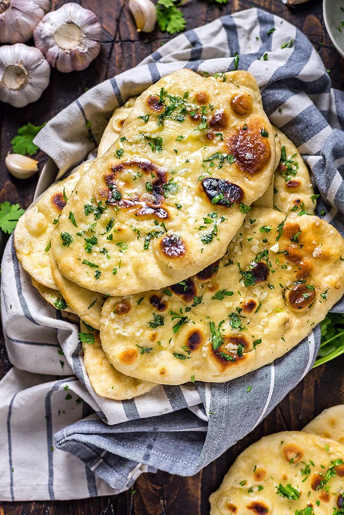 Homemade Garlic Naan on a white and grey cloth