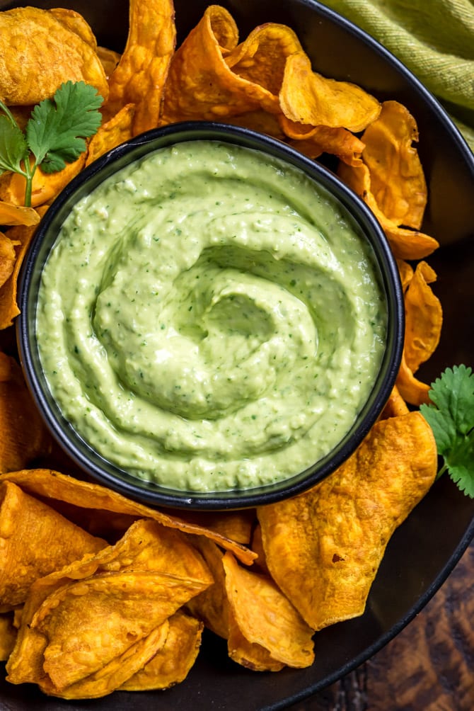 This Dreamy, Creamy Avocado Cilantro Sauce takes just 5 minutes to make and is perfect for serving on tacos, over salads, with sweet potatoes, or simply with a side of chips for dipping. Let's be honest, you're going to eat it on everything. | hostthetoast.com