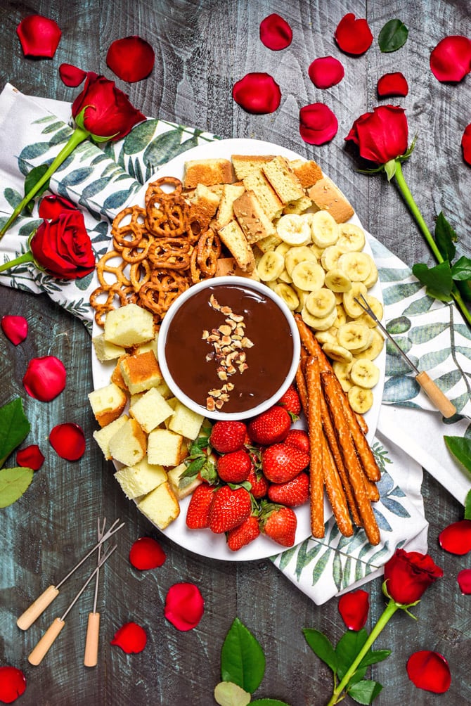 The Easiest Boozy Chocolate Hazelnut Fondue. All you need for this recipe is 5 ingredients and a microwave. It doesn't get easier than that for date night! | hostthetoast.com