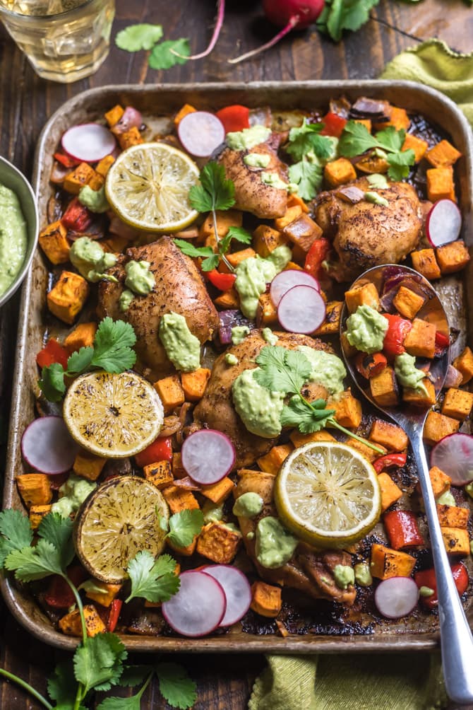 Sheet Pan Chili-Lime Chicken and Sweet Potatoes. Juicy chicken thighs, tender chunks of sweet potato, onion, and bell pepper are all tossed in a spicy, sweet, and citrusy marinade before baking all together for a one pan, healthy recipe. | hostthetoast.com