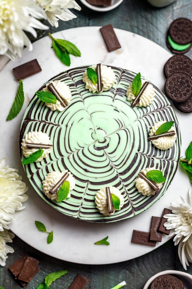 This No-Bake Mint Chocolate Zebra Cheesecake is just as delicious as it is hypnotically stunning. Be warned: It's rich, chocolaty, spiked with plenty of mint, silky smooth, and a total ruiner of self-control. | hostthetoast.com