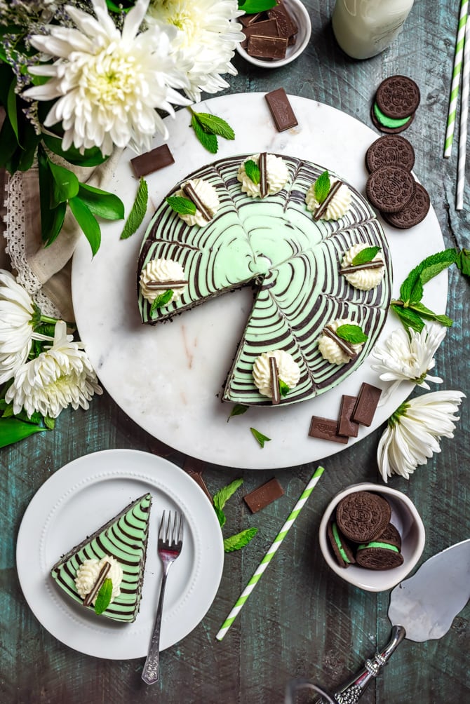 This No-Bake Mint Chocolate Zebra Cheesecake is just as delicious as it is hypnotically stunning. Be warned: It's rich, chocolaty, spiked with plenty of mint, silky smooth, and a total ruiner of self-control. | hostthetoast.com