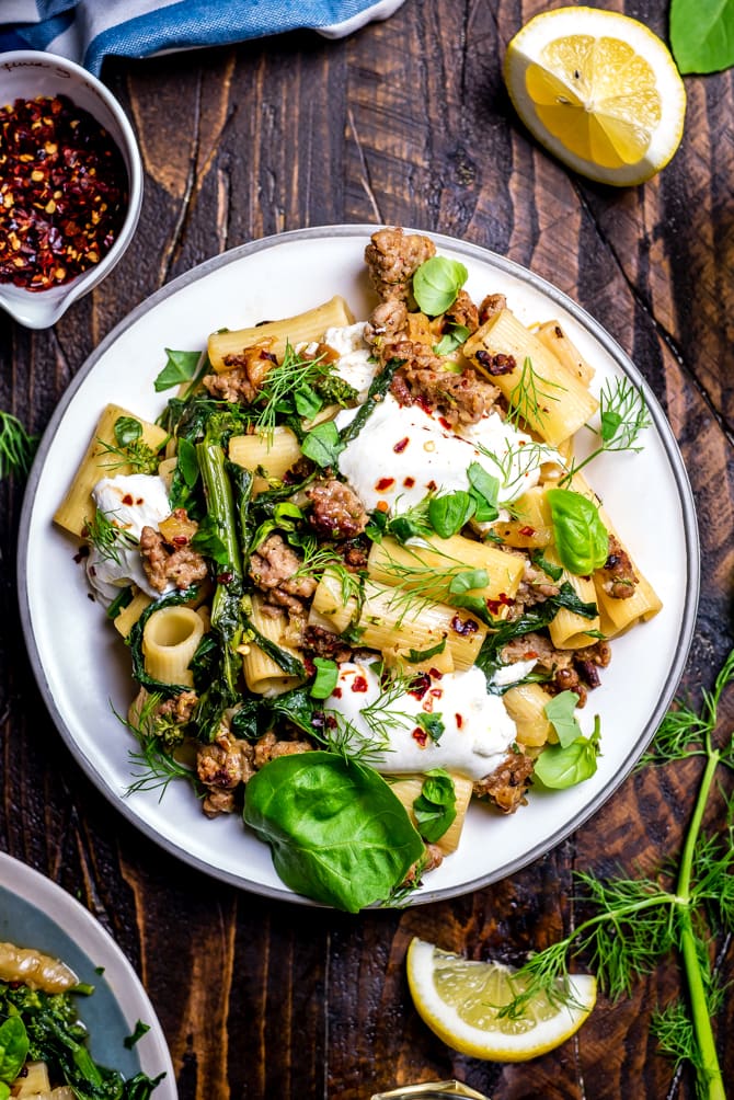 This quick One Pot Lemony Pasta with Sausage, Broccoli Rabe, and Burrata is absolutely loaded with bright and comforting flavors. It takes just 40 minutes to make and is the perfect easy date night-- or weeknight-- dinner. | hostthetoast.com