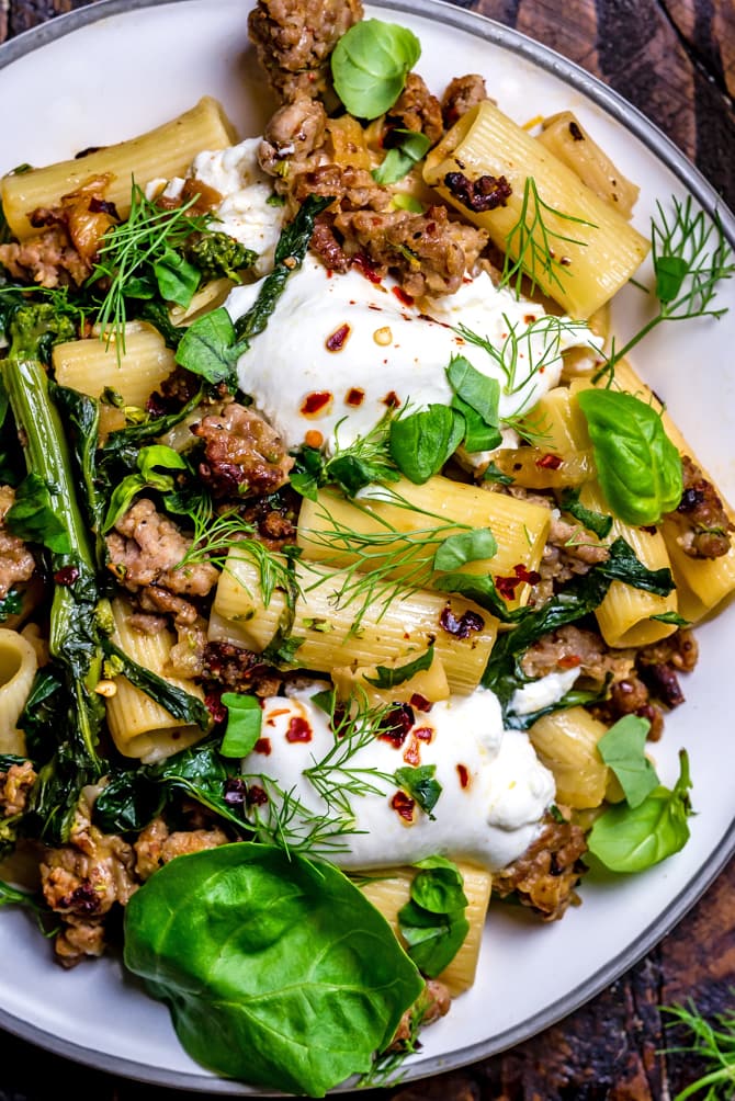 This quick One Pot Lemony Pasta with Sausage, Broccoli Rabe, and Burrata is absolutely loaded with bright and comforting flavors. It takes just 40 minutes to make and is the perfect easy date night-- or weeknight-- dinner. | hostthetoast.com