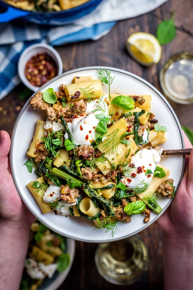 This quick One Pot Lemony Pasta with Sausage, Broccoli Rabe, and Burrata is absolutely loaded with bright and comforting flavors. It takes just 40 minutes to make and is the perfect easy date night-- or weeknight-- dinner. | hostthetoast.com