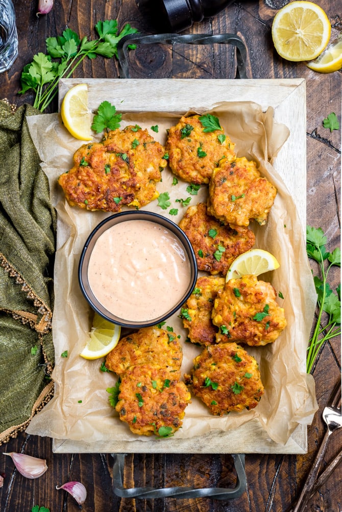 These Cajun Shrimp and Corn Cakes take just 20 minutes to make and even less time to fly off the plate. They're the perfect treat for seafood lovers, whether they're served for a Mardi Gras dinner, as a party appetizer, or simply on toasted buns with lettuce, onion, and remoulade.| hostthetoast.com
