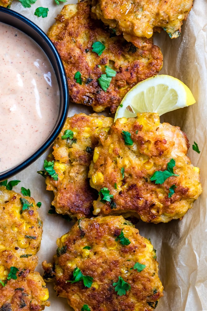 These Cajun Shrimp and Corn Cakes take just 20 minutes to make and even less time to fly off the plate. They're the perfect treat for seafood lovers, whether they're served for a Mardi Gras dinner, as a party appetizer, or simply on toasted buns with lettuce, onion, and remoulade. | hostthetoast.com