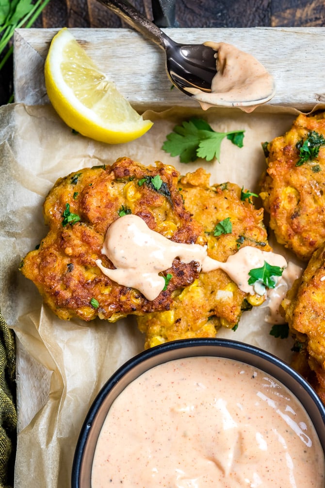 These Cajun Shrimp and Corn Cakes take just 20 minutes to make and even less time to fly off the plate. They're the perfect treat for seafood lovers, whether they're served for a Mardi Gras dinner, as a party appetizer, or simply on toasted buns with lettuce, onion, and remoulade.| hostthetoast.com
