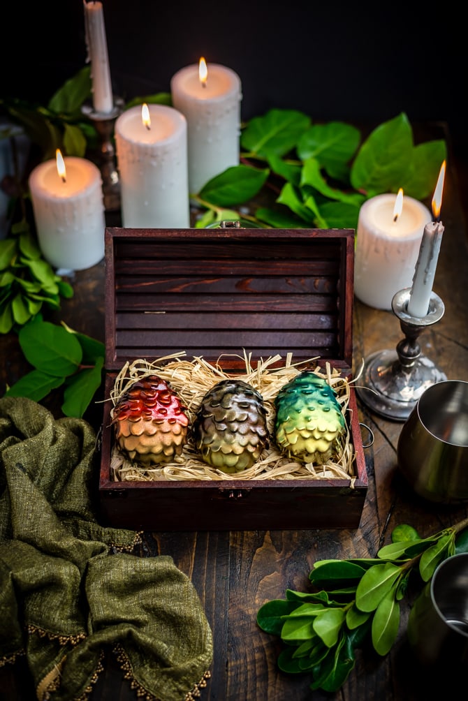 Easter is coming! There's no better way to celebrate the holiday and the return of Game of Thrones than by making your own Chocolate Peanut Butter Dragon Eggs at home. This recipe includes a Reese's-style peanut butter filling, crunchy sliced almond "scales", and a smooth chocolate coating. | hostthetoast.com
