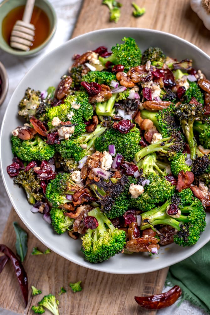 Seared (but still crisp) broccoli forms the flavorful base of this Charred Broccoli Salad with Hot Honey Dressing. With toasted pecans, sharp red onion, crisp bacon, tangy goat cheese, dried cranberries, and a sweet-and-slightly-spicy homemade hot honey dressing, this side dish has a little bit of everything for your cookout, dinner party, or lunch box.  | hostthetoast.com