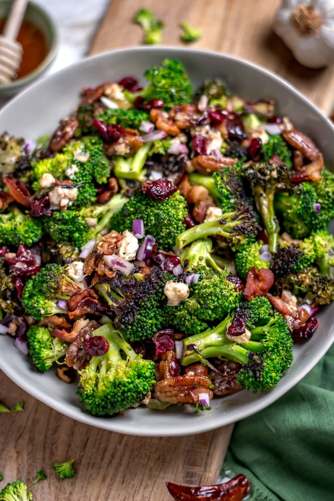 Seared (but still crisp) broccoli forms the flavorful base of this Charred Broccoli Salad with Hot Honey Dressing. With toasted pecans, sharp red onion, crisp bacon, tangy goat cheese, dried cranberries, and a sweet-and-slightly-spicy homemade hot honey dressing, this side dish has a little bit of everything for your cookout, dinner party, or lunch box. | hostthetoast.com