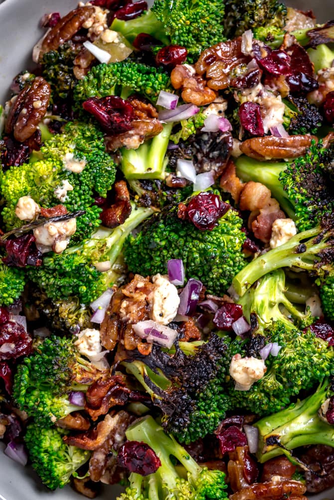 Seared (but still crisp) broccoli forms the flavorful base of this Charred Broccoli Salad with Hot Honey Dressing. With toasted pecans, sharp red onion, crisp bacon, tangy goat cheese, dried cranberries, and a sweet-and-slightly-spicy homemade hot honey dressing, this side dish has a little bit of everything for your cookout, dinner party, or lunch box. | hostthetoast.com