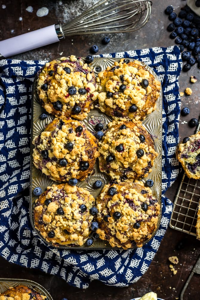 Big, fluffy, moist, bursting with blueberry flavor, and topped with crumbly streusel, these homemade muffins are better than you could buy. I call them The Best Bakery-Style Blueberry Muffins, and they pull out all of the tricks for perfect muffins, from how to get a perfectly domed top to how to prevent the blueberries from sinking to the bottom of the batter.  | hostthetoast.com