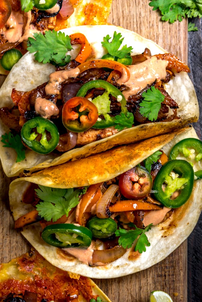 With classic fajita ingredients piled high in crispy cheddar-adorned tortillas and finished with a 3-ingredient chipotle crema, this recipe is bound to be your new Tex-Mex favorite. Crispy Cheddar Chipotle Chicken Fajitas make for an easy, flavor-packed, and picky-eater-approved weeknight dinner. | hostthetoast.com