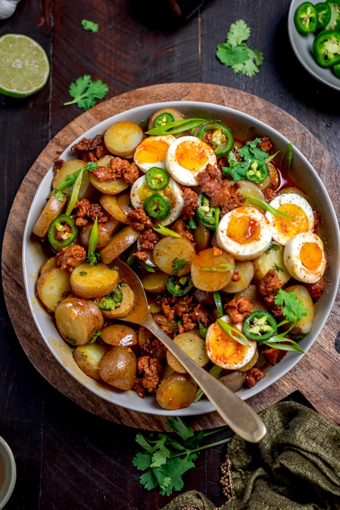 With a whisper of smoke and spice, Warm Chorizo Potato Salad is a Mexican-inspired spin on the German classic. Served with soft-boiled eggs and a chorizo vinaigrette, this mayo-free mash-up is best served warm.  | hostthetoast.com
