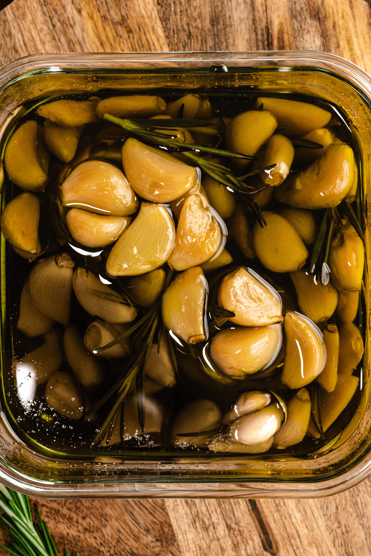 Garlic lovers rejoice: You can make homemade garlic confit and garlic oil with only a few minutes of prep time. Slowly roasting garlic cloves in olive oil allows them to become mild, caramelized, and tender enough to spread with a butter knife.