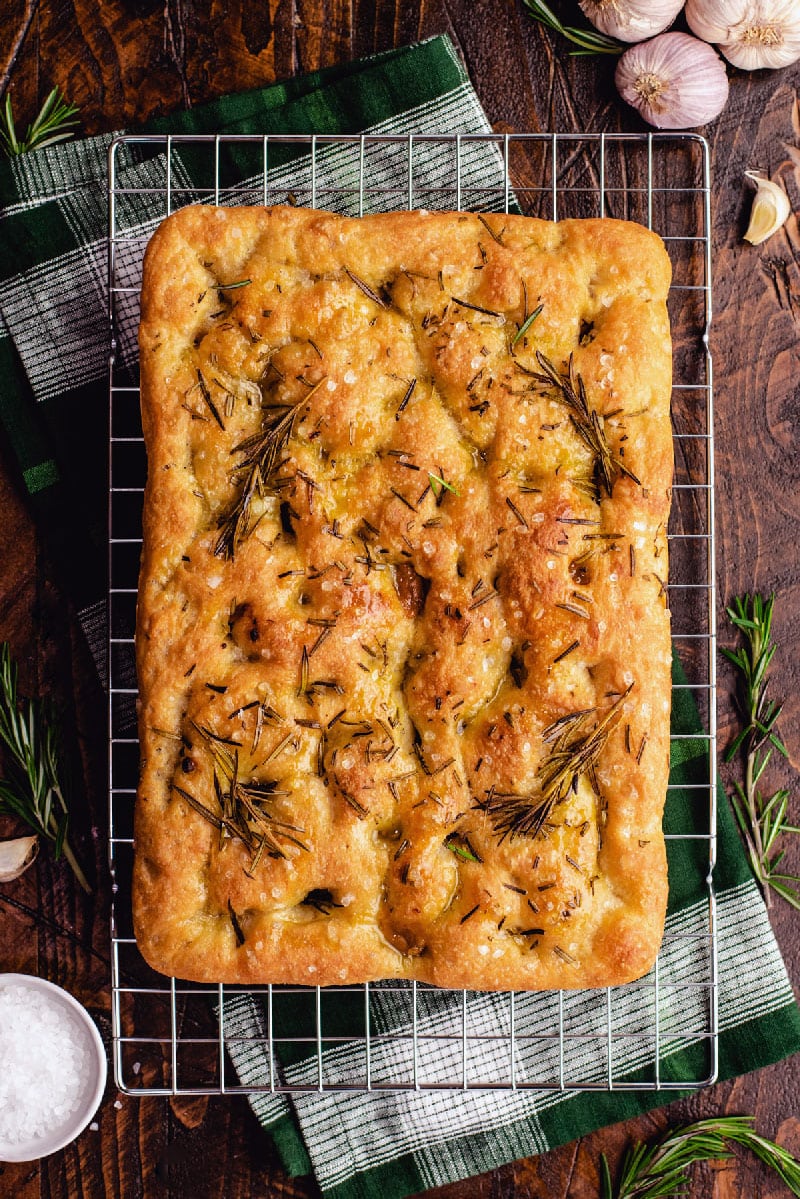 This EASY No-Knead Garlic and Rosemary Focaccia is all about letting time do all of the hard work for you. With just 20 minutes of easy active prep time, you can make an amazingly chewy, creamy garlic-studded, crisp-crusted, tender bread.