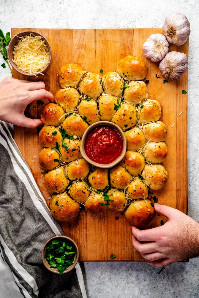 What do you get when you combine garlic knots, melty mozzarella, and mini Italian meatballs? You get the perfect party appetizer: Cheesy Garlic Meatball Bombs. It's like a garlic-butter-slathered meatball sub, but snack-sized, and minus the mess. 