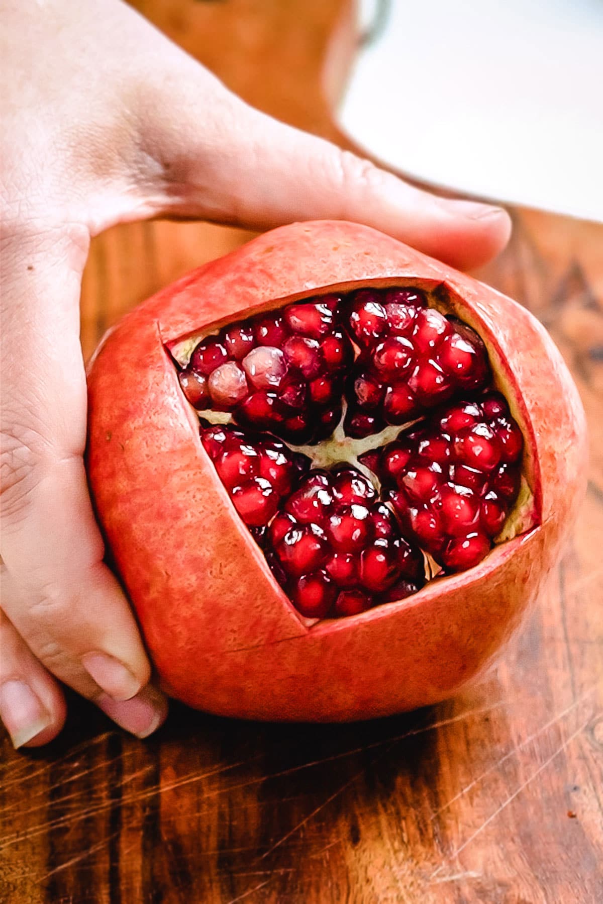 Pomegranate with the top removed to expose the seeds