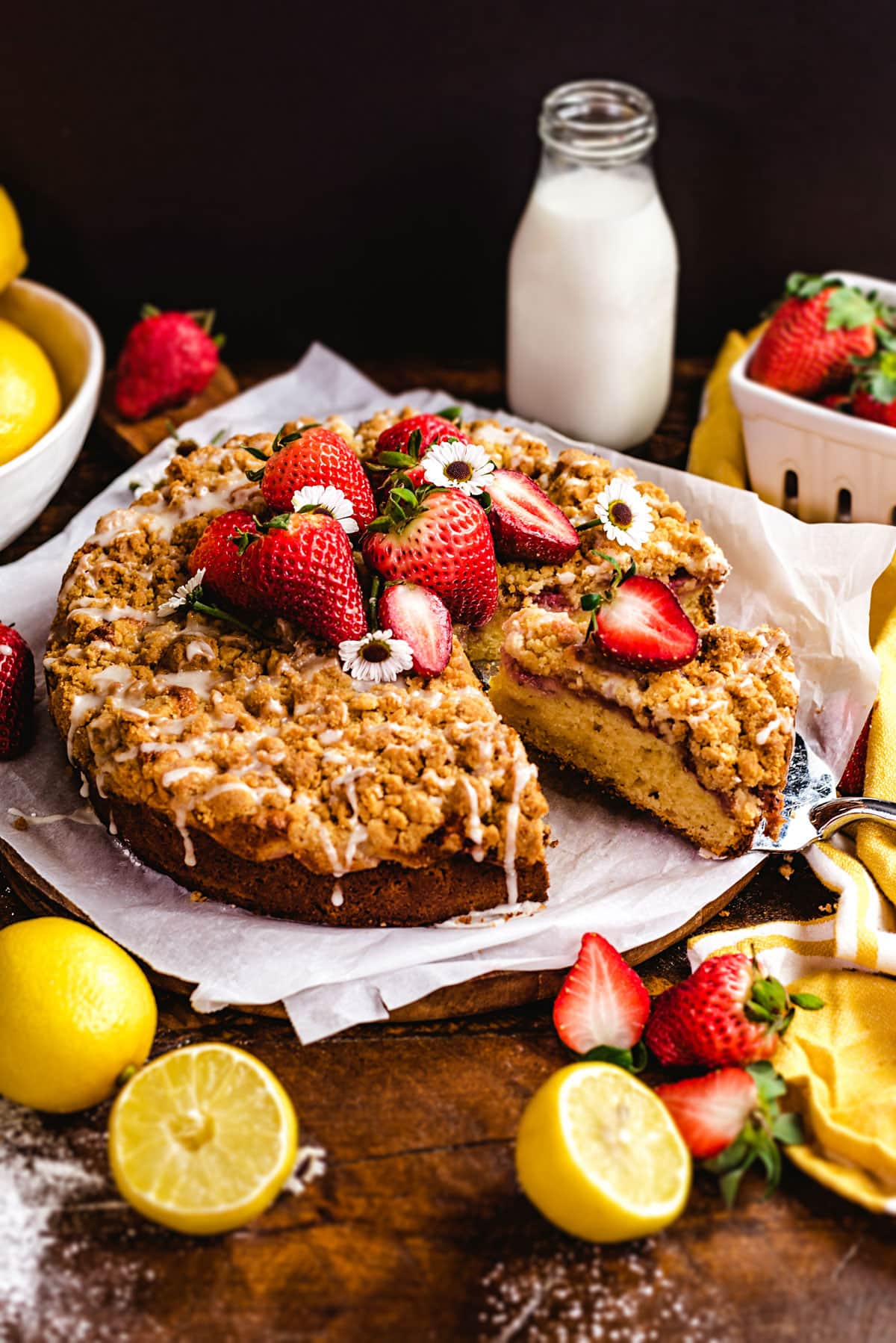 This buttery, bright Strawberry Lemon-Ricotta Crumb Cake features a layer of fresh sliced strawberries, a crumbly streusel topping, and a drizzle of sweet glaze atop a moist lemon cake. Serve it for an elegant breakfast, brunch, or dessert, and make lemon-lovers out of everyone who takes a bite.